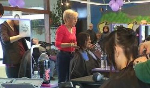 Action d'un coiffeur hutois